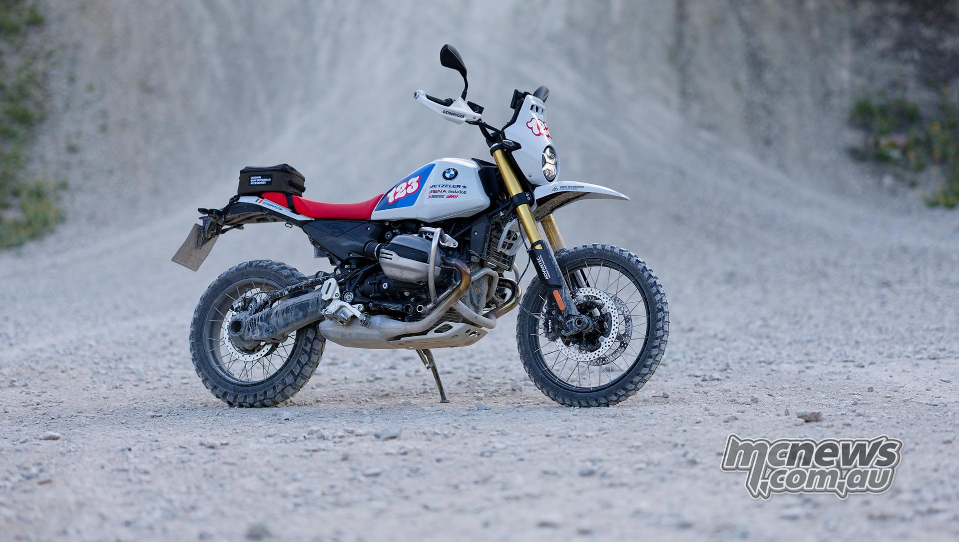 Rider putting the R 12 G/S GS Trophy Competition Bike through a gravel corner