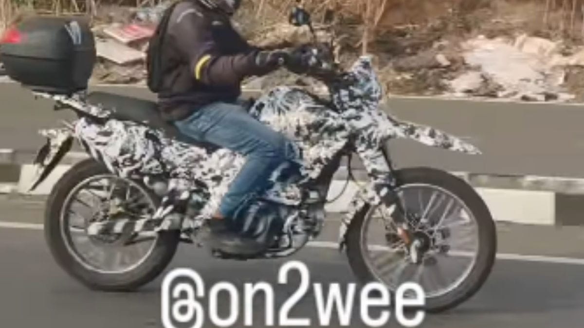 Rear three-quarter view of the Bajaj ADV prototype, showing the Pulsar NS200-derived taillight and top box