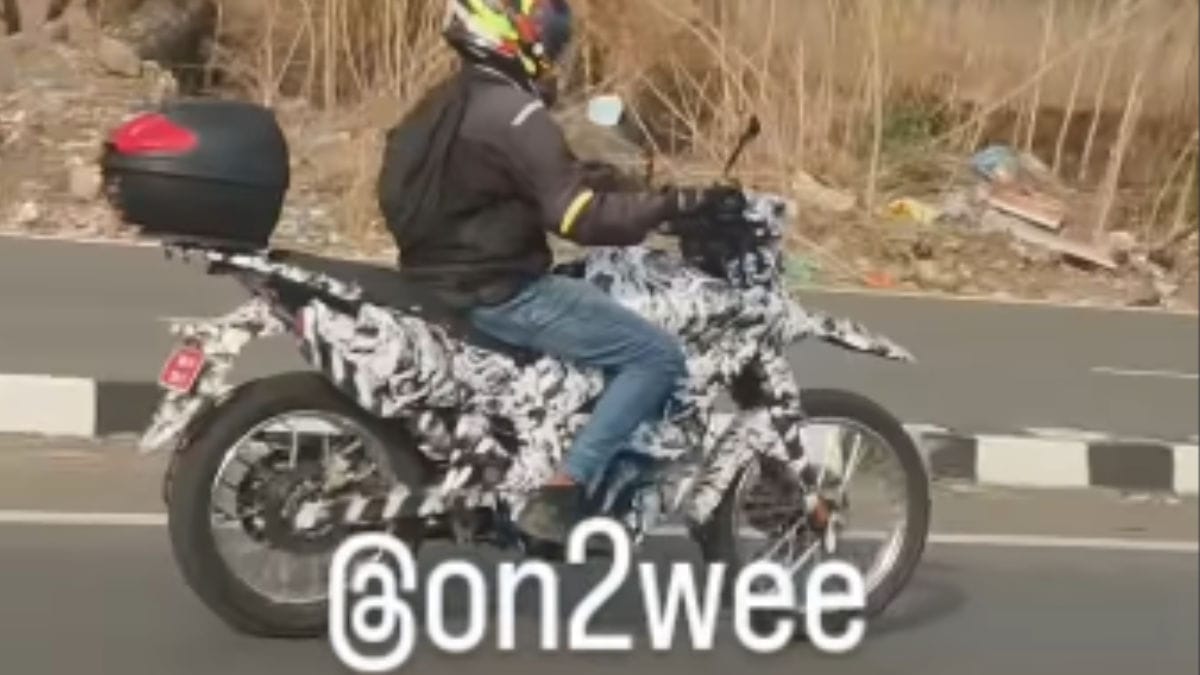 The Bajaj ADV test mule's spoke wheels and long-travel suspension setup