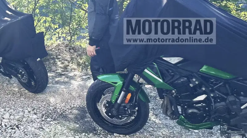 Camouflaged Kawasaki Versys 900 prototype spied during a promotional shoot, rear three-quarter view
