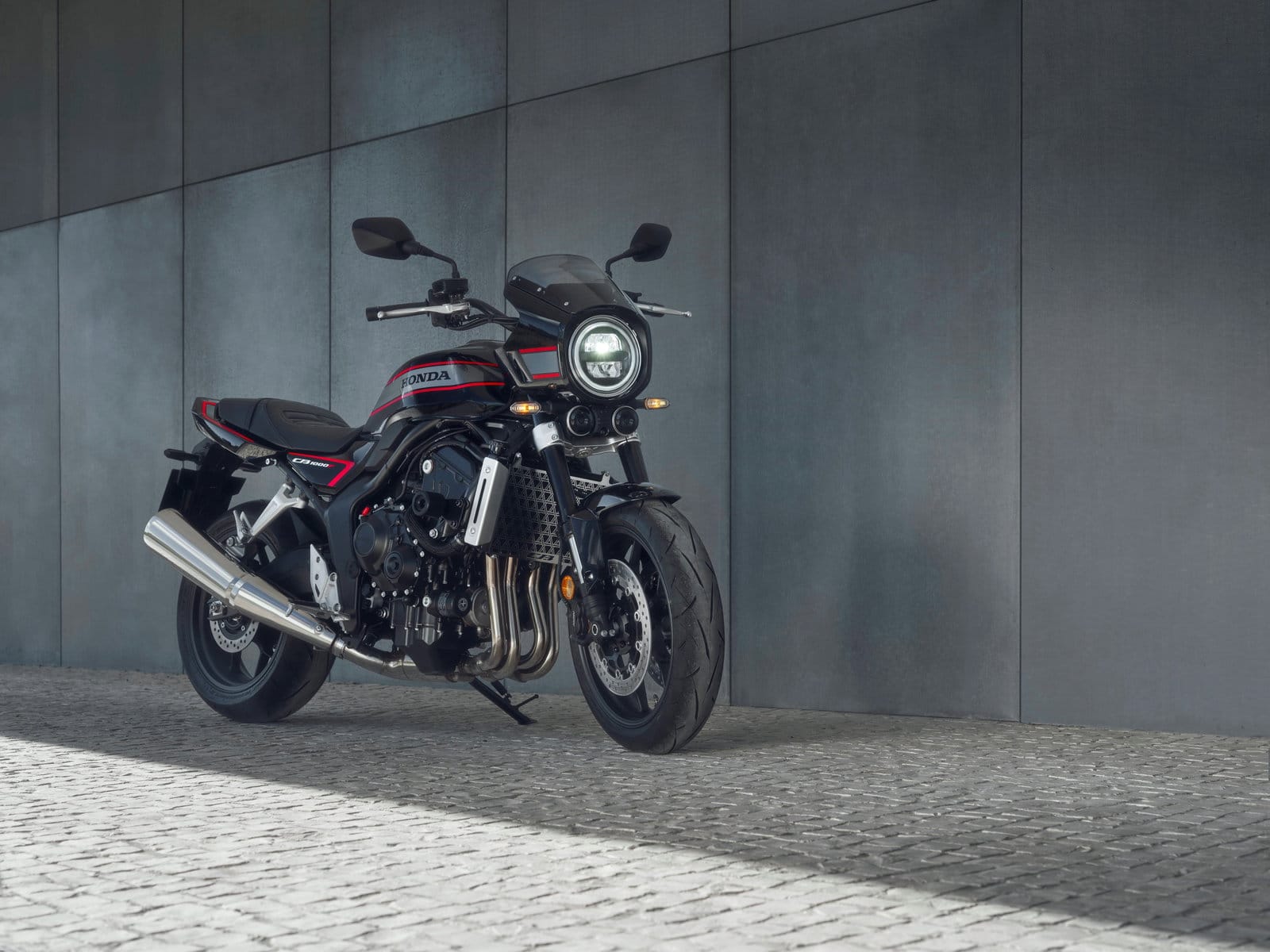 2026 Honda CB1000F studio shot showing the four-cylinder engine and exhaust detail