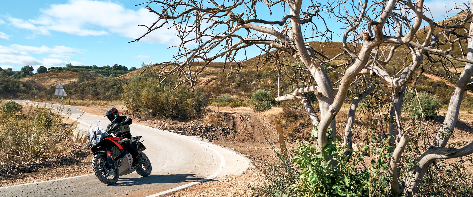 2026 KTM 790 Adventure, action shot, riding on a gravel road