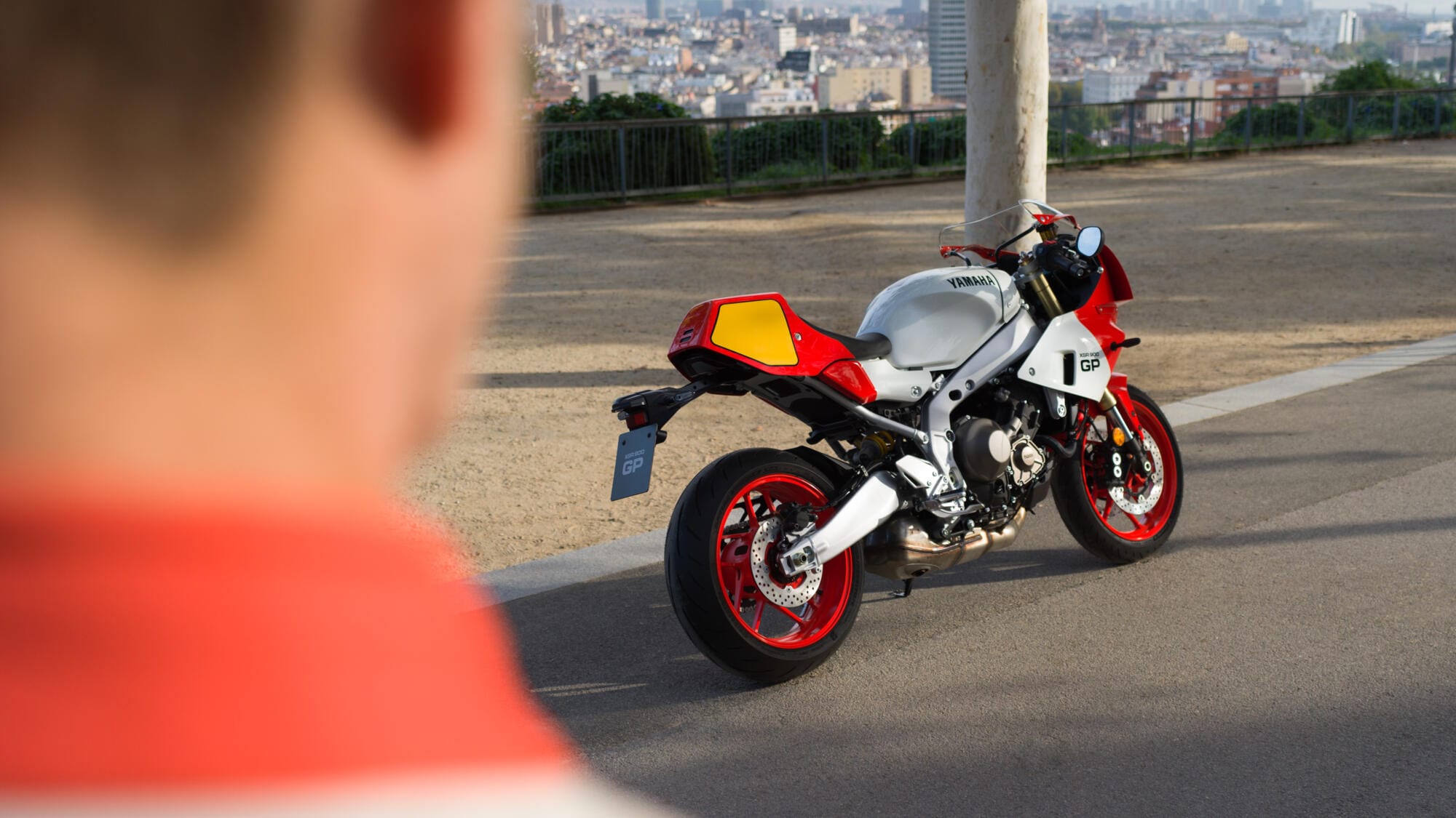 Yamaha XSR900 GP in Legend Red livery, static studio shot showing its half-fairing and clip-on bars