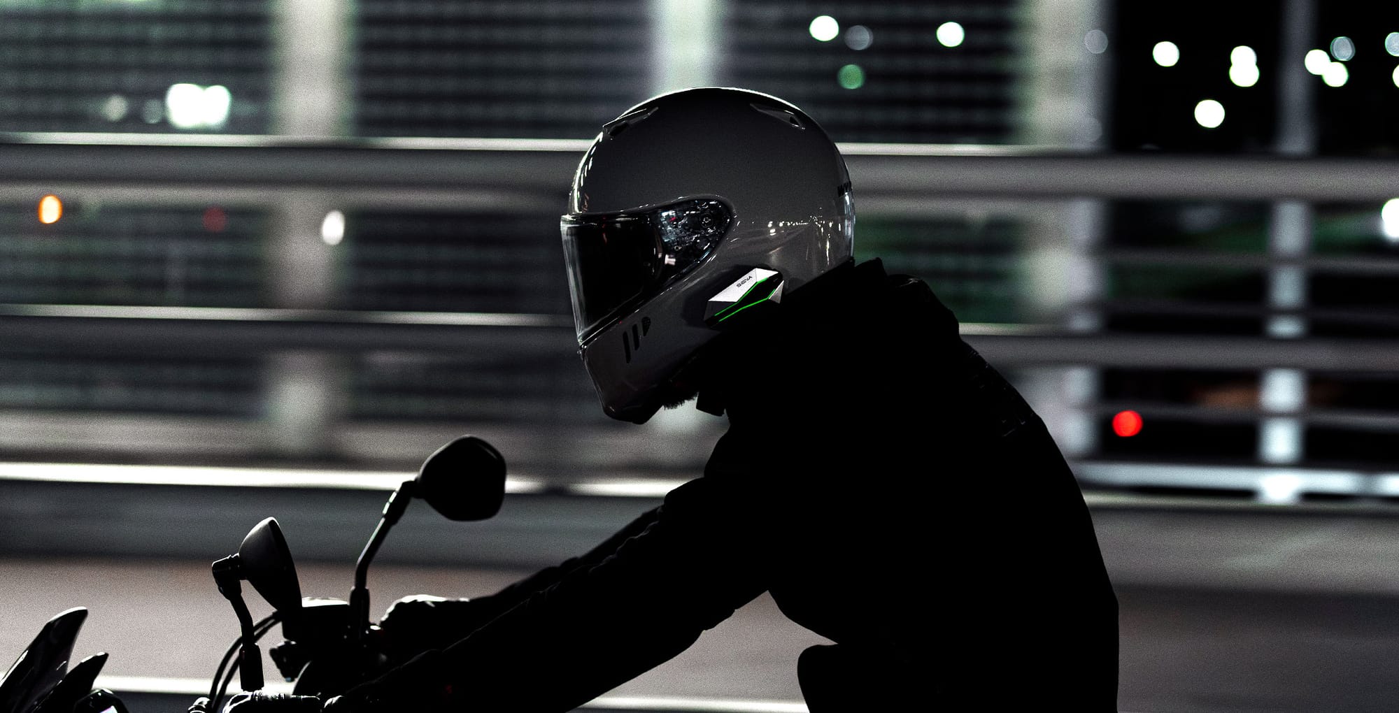 Sena 60X mesh intercom control unit and speaker set mounted on a motorcycle helmet shell