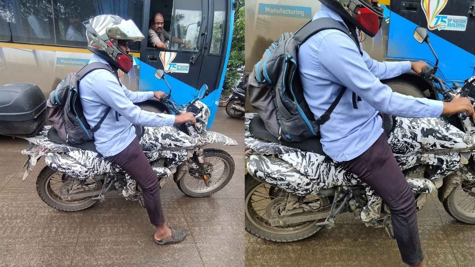 Camouflaged Bajaj adventure motorcycle prototype, front three-quarter view, testing on an Indian road