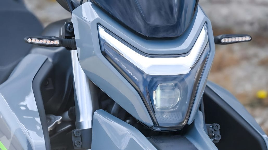 CFMoto Dual 250 dual-sport, right side view, tall stance with raised front mudguard and spoked wheels