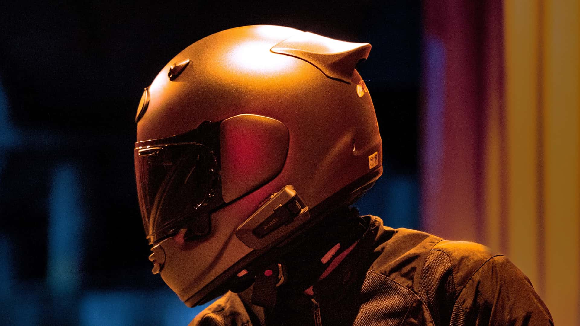 An Arai full-face motorcycle helmet photographed to illustrate ECE 22.06 homologation testing