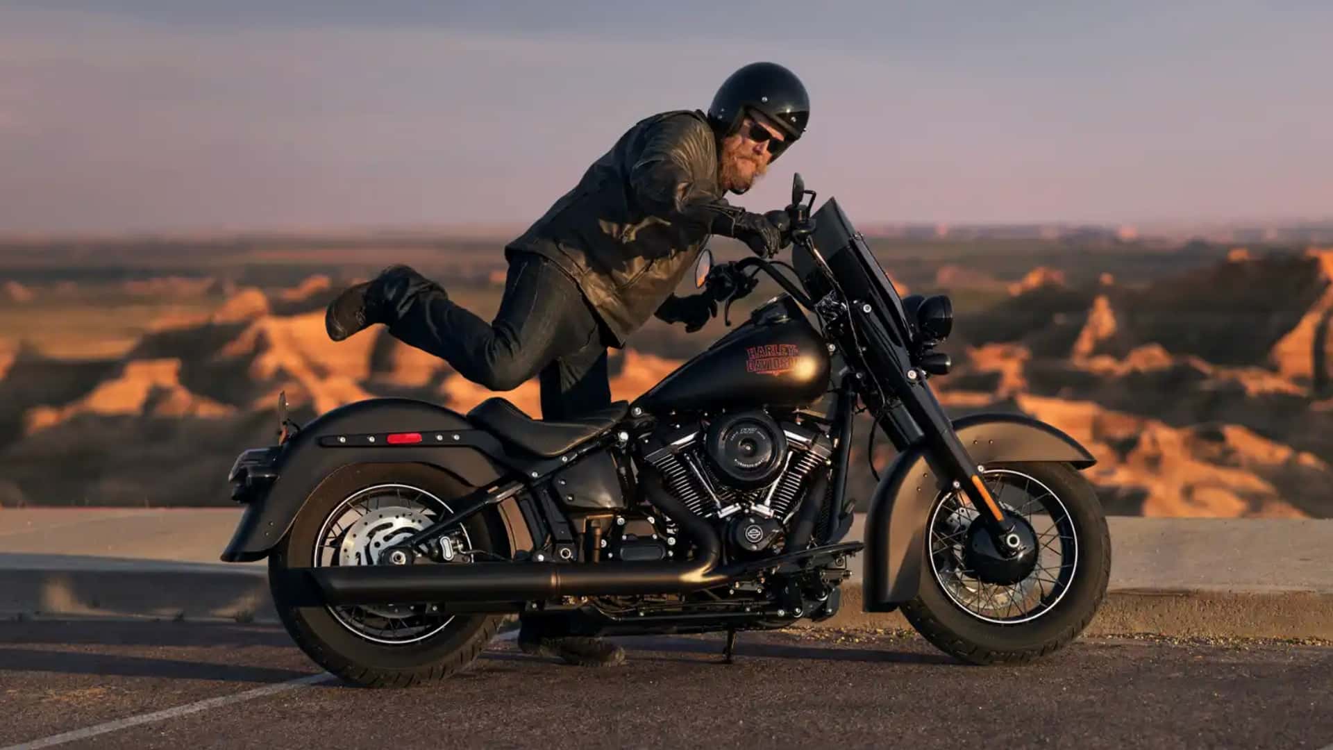 Harley-Davidson cruiser motorcycle parked outdoors, front three-quarter view