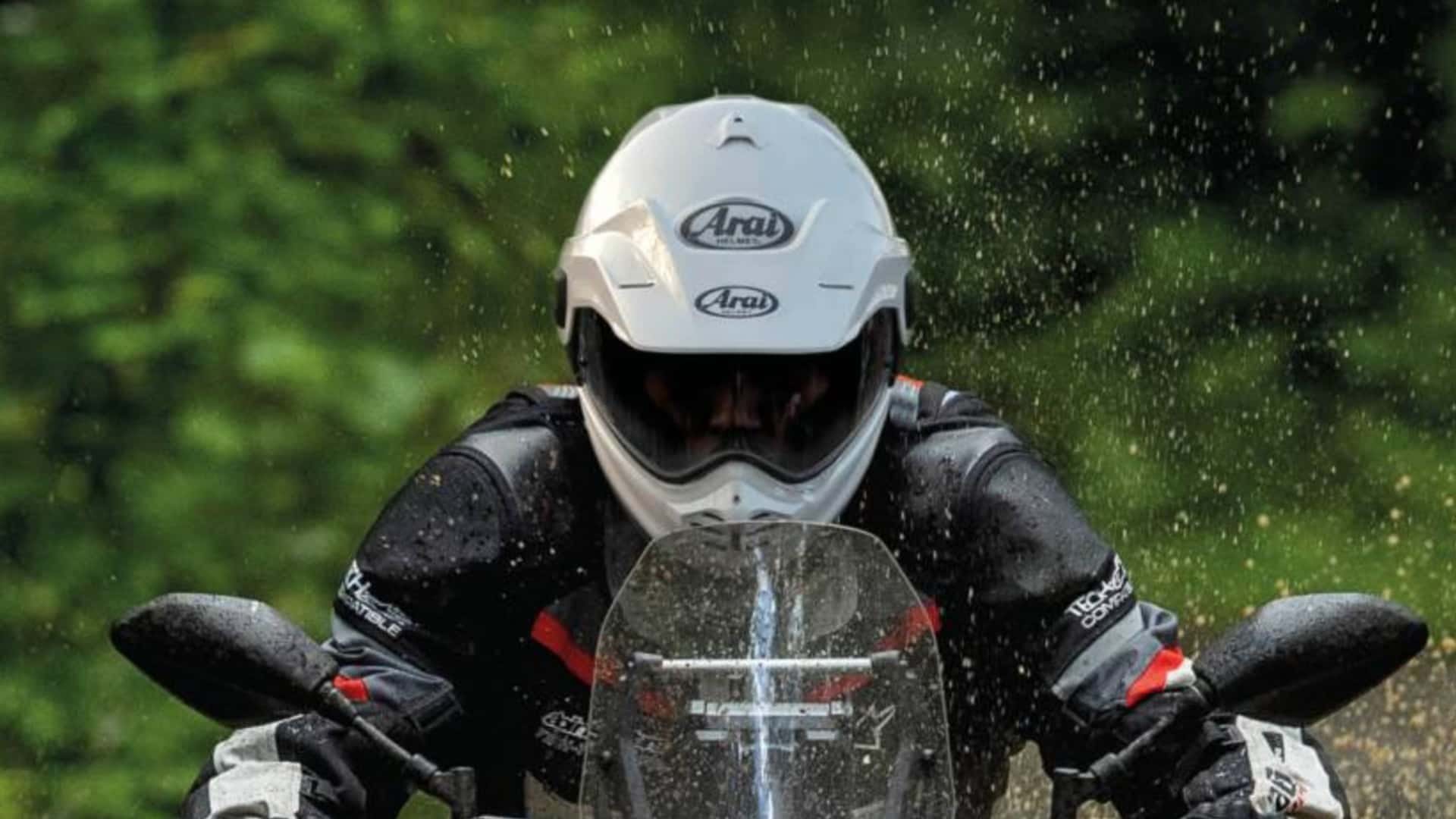 Arai Tour-X5 adventure helmet, three-quarter studio shot with peak and visor fitted