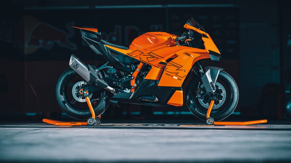 KTM 990 RC R supersport, studio side view in orange and black -- the current flagship of KTM's expanding RC line