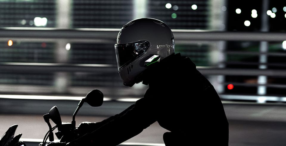 Sena 60X mesh intercom control unit and speaker set mounted on a motorcycle helmet shell