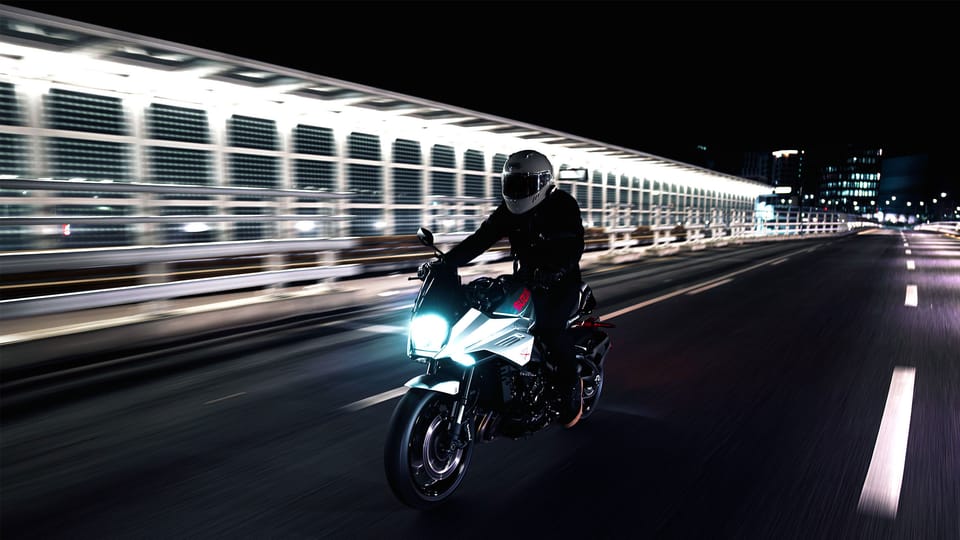 Sena 60X motorcycle communication unit, front three-quarter product shot showing the joystick control and low-profile housing