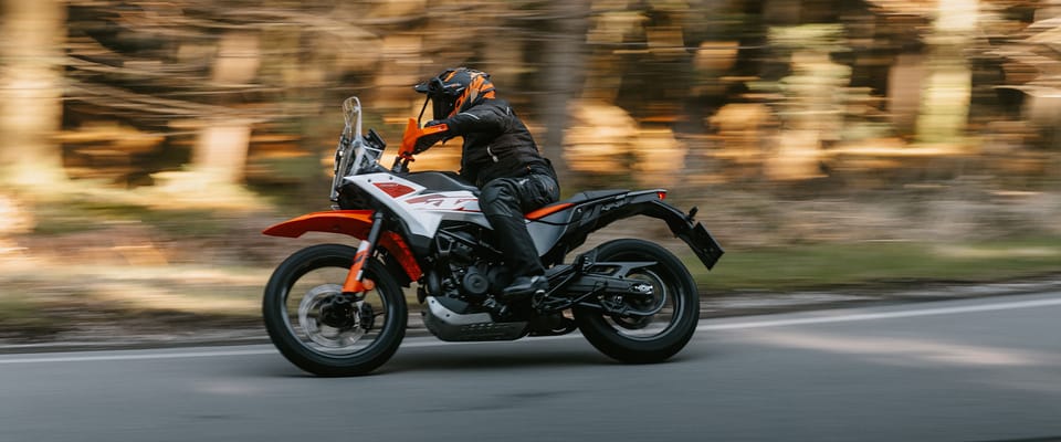 KTM 390 Adventure X, an A2-legal middleweight adventure bike, on a gravel road