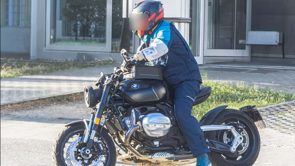 BMW R20 prototype during road testing, matte black tank, solo bobber-style seat and visible Paralever shaft drive