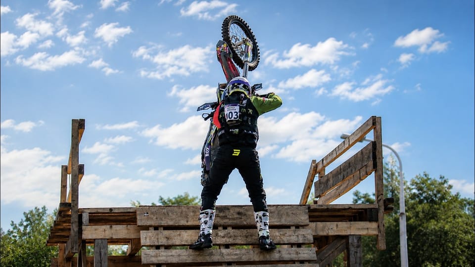 Graham Jarvis riding his Husqvarna through a rocky hillclimb section at Red Bull Romaniacs 2026