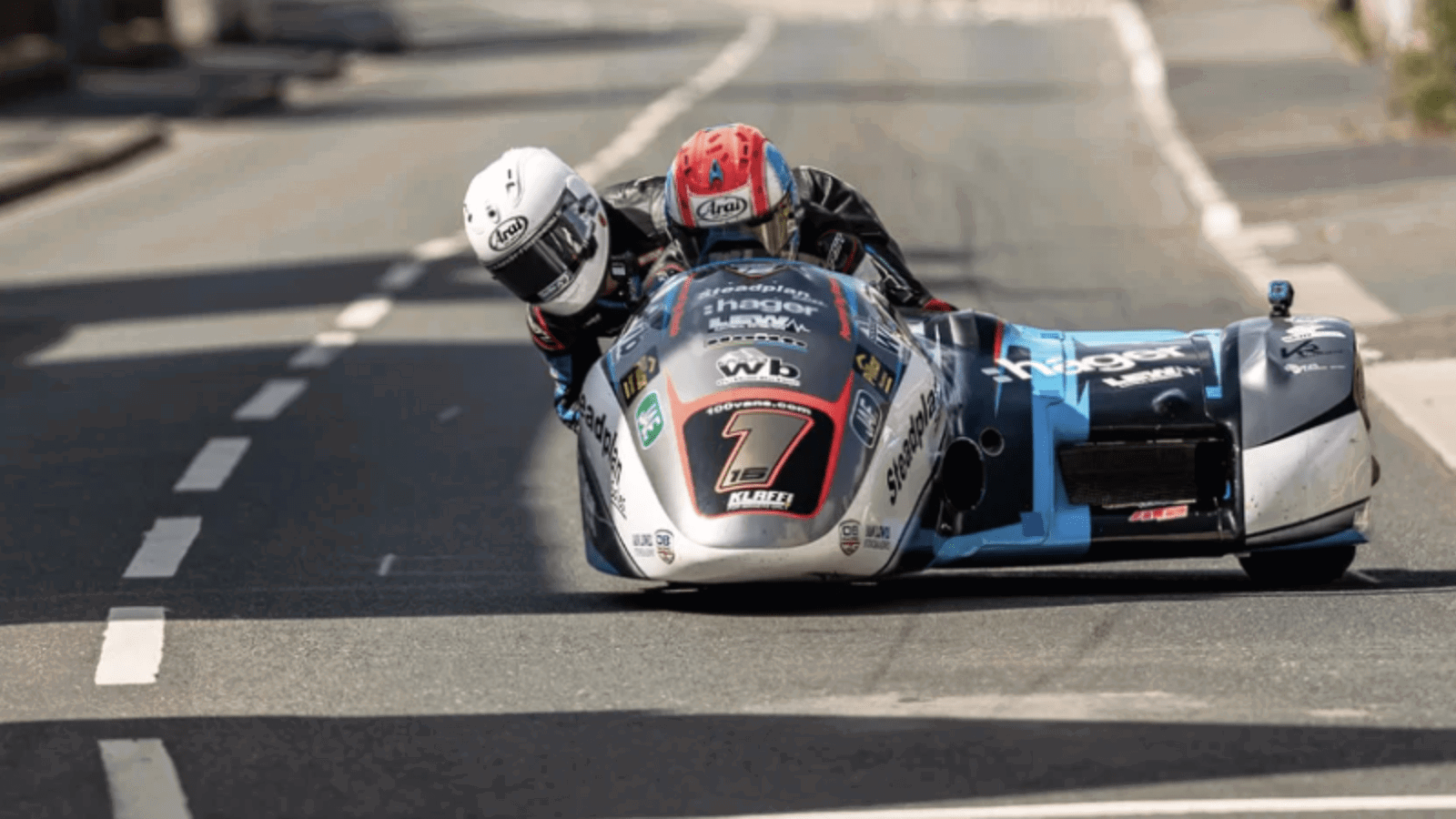 Ben Birchall and Kevin Rousseau's sidecar outfit cornering at the Isle of Man TT