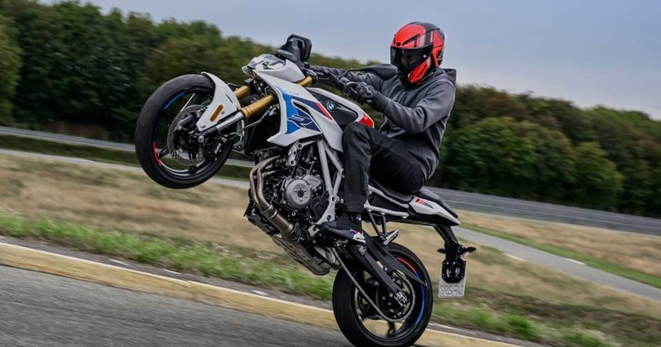 BMW F 450 R naked motorcycle, front three-quarter studio shot